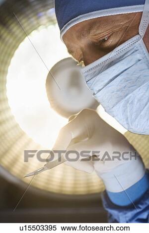 Surgeon at work View Large Photo Image Stock Photography - Surgeon at work. Fotosearch