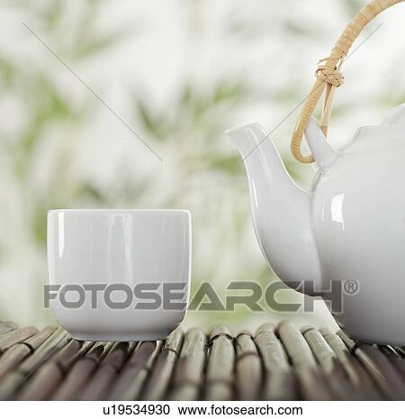 Teapot and cup on bamboo View Large Photo Image Stock Image - Teapot and cup on bamboo. Fotosearch