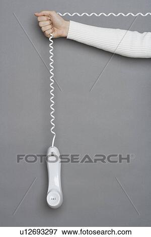 Stock Photo - Telephone dangling by cord. Fotosearch
