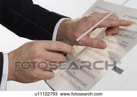 Stock Image - The hands of an orchestra conductor. Fotosearch