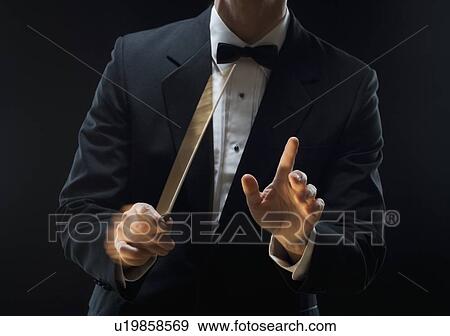 Stock Photo - The hands of an orchestra conductor. Fotosearch