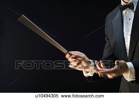 Stock Photography - The hands of an orchestra conductor. Fotosearch