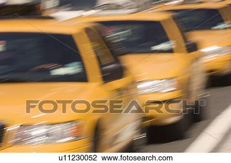 Three taxi cabs on street in New York NY View Large Photo Image Stock Image - Three taxi cabs on street in New York NY. Fotosearch