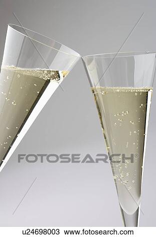 Stock Image - Toasting with champagne glasses. Fotosearch