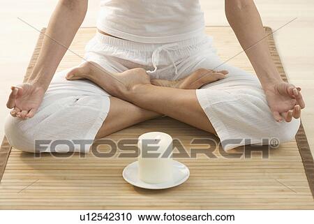 Torso of person doing yoga View Large Photo Image Stock Image - Torso of person doing yoga. Fotosearch