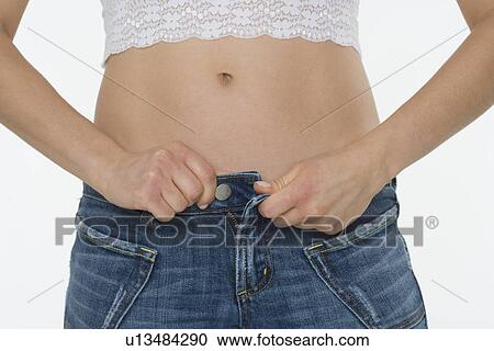 Torso of woman in blue jeans View Large Photo Image Stock Image - Torso of woman in blue jeans. Fotosearch