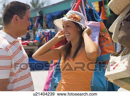 Stock Photo - Tourist couple at market. Fotosearch