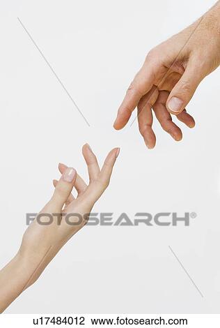 Two hands about to touch View Large Photo Image Stock Image - Two hands about to touch. Fotosearch