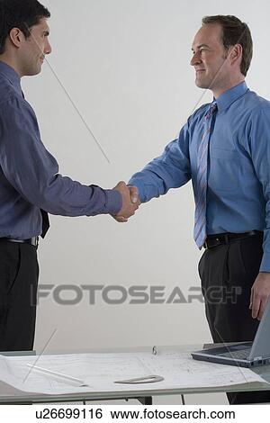 Stock Photograph - Two men shaking hands. Fotosearch