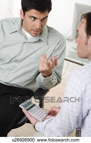 Two men talking View Large Photo Image Stock Image - Two men talking. Fotosearch