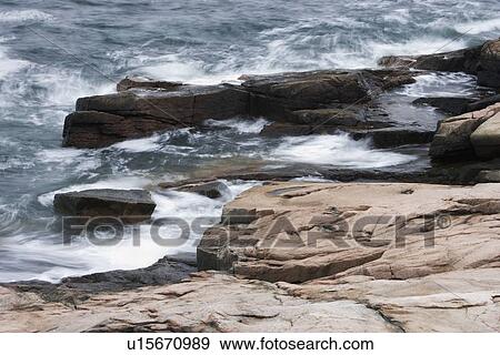 Stock Photo - Waves breaking on the Maine coast. Fotosearch