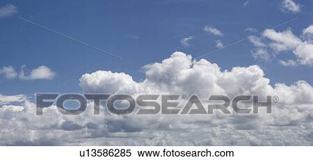 Stock Photography - White clouds in blue sky. Fotosearch