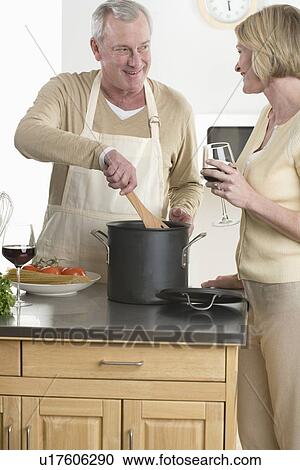 Wife and husband cooking View Large Photo Image Stock Image - Wife and husband cooking. Fotosearch