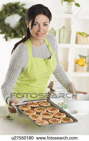 Woman baking Christmas cookies View Large Photo Image Stock Image - Woman baking Christmas cookies. Fotosearch