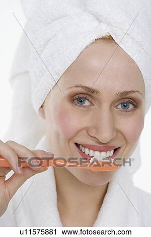 Woman brushing teeth View Large Photo Image Stock Image - Woman brushing teeth. Fotosearch