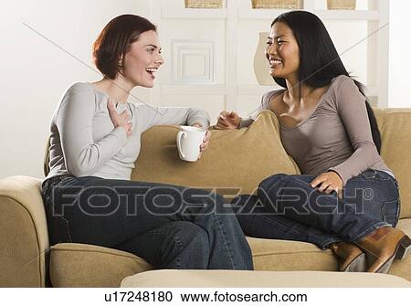 Stock Image - Woman friends talking. Fotosearch