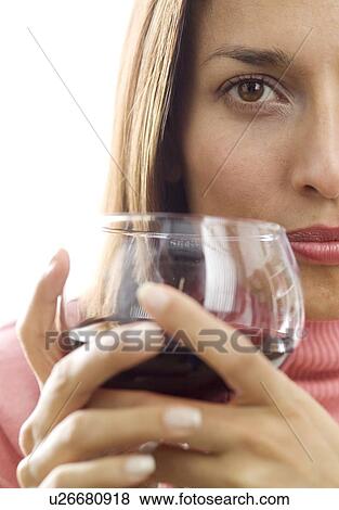 Woman holding a glass of red wine View Large Photo Image Stock Photo - Woman holding a glass of red wine. Fotosearch