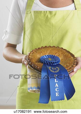 Woman holding prize winning pie View Large Photo Image Stock Image - Woman holding prize winning pie. Fotosearch