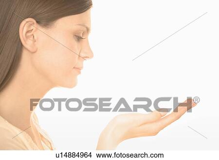Woman holding up her hand View Large Photo Image Picture - Woman holding up her hand. Fotosearch