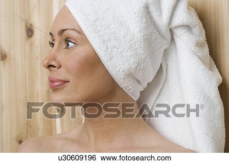 Woman in sauna with head wrapped in towel View Large Photo Image Stock Photograph - Woman in sauna with head wrapped in towel. Fotosearch