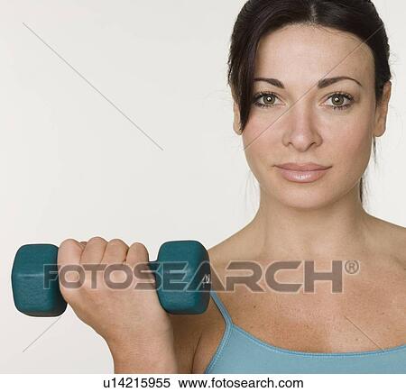 Woman lifting weights View Large Photo Image Stock Photography - Woman lifting weights. Fotosearch