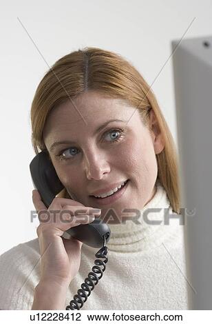 Woman on telephone with computer View Large Photo Image Stock Image - Woman on telephone with computer. Fotosearch