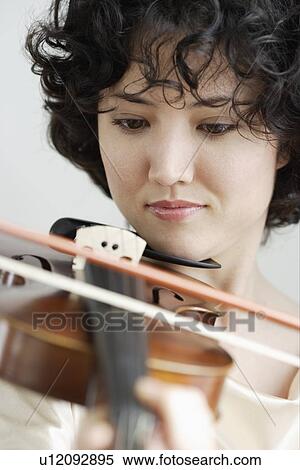 Woman playing the violin View Large Photo Image Stock Photography - Woman playing the violin. Fotosearch