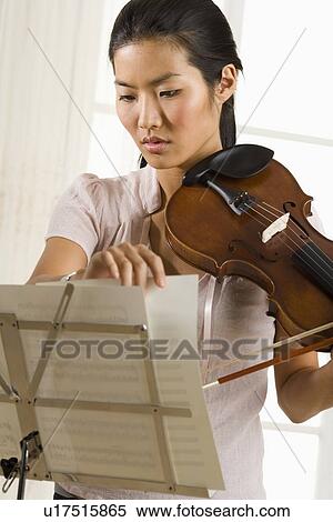 Stock Photography - Woman playing the violin. Fotosearch