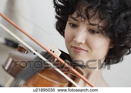 Stock Photography - Woman playing the violin. Fotosearch