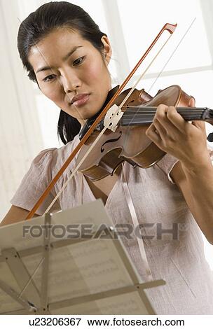 Stock Photo - Woman playing violin. Fotosearch
