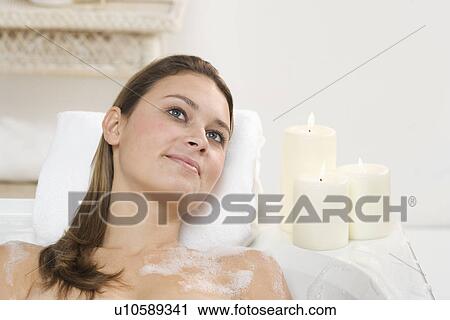 Woman relaxing in bathtub View Large Photo Image Stock Image - Woman relaxing in bathtub. Fotosearch