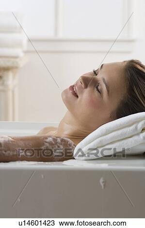 Woman relaxing in bathtub View Large Photo Image Stock Image - Woman relaxing in bathtub. Fotosearch