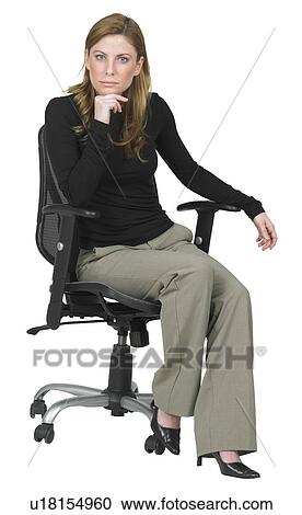 Woman sitting in chair View Large Photo Image Stock Image - Woman sitting in chair. Fotosearch