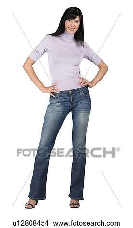 Picture - Woman standing with hands on her hips. Fotosearch