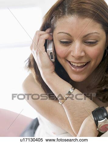 Woman talking on mobile phone View Large Photo Image Stock Photography - Woman talking on mobile phone. Fotosearch