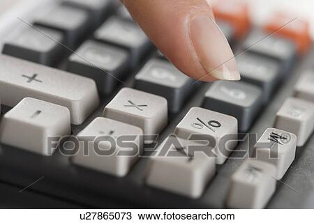 Woman using a calculator View Large Photo Image Stock Image - Woman using a calculator. Fotosearch