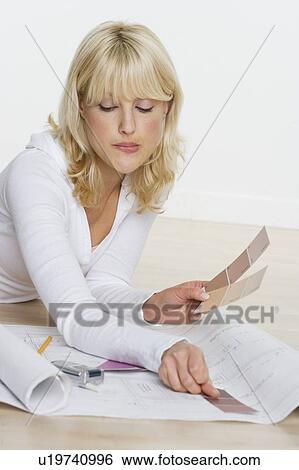 Woman with color samples and blueprints View Large Photo Image Stock Photograph - Woman with color samples and blueprints. Fotosearch