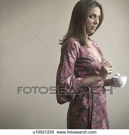 Stock Photography - Woman with dark glasses and phone earpiece. Fotosearch