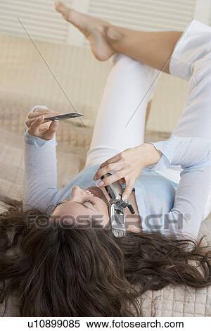 Woman with mobile phone and credit card View Large Photo Image Stock Photography - Woman with mobile phone and credit card. Fotosearch