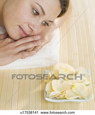 Woman with plate of flower petals View Large Photo Image Stock Image - Woman with plate of flower petals. Fotosearch