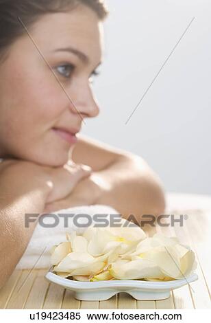 Woman with plate of flower petals View Large Photo Image Stock Photography - Woman with plate of flower petals. Fotosearch