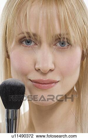 Woman with powder brush View Large Photo Image Stock Image - Woman with powder brush. Fotosearch