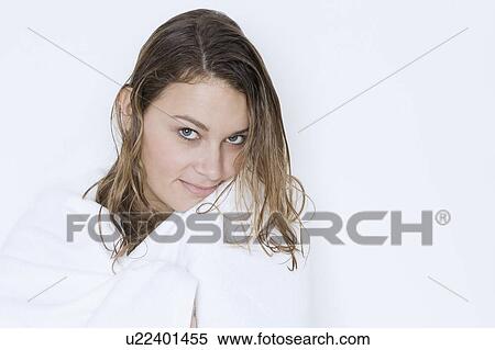 Stock Photography - Woman with wet hair wrapped in towel. Fotosearch