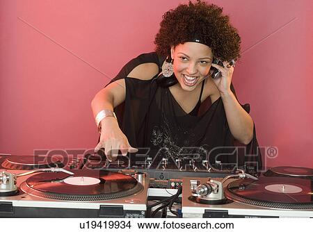 Woman working at a mixing board View Large Photo Image Picture - Woman working at a mixing board. Fotosearch