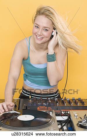 Woman working at a mixing board View Large Photo Image Picture - Woman working at a mixing board. Fotosearch