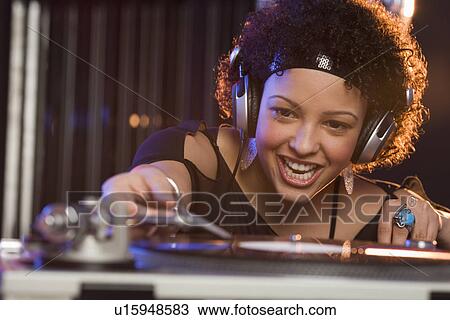 Woman working at a mixing board View Large Photo Image Stock Image - Woman working at a mixing board. Fotosearch