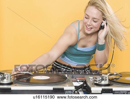Woman working at a mixing board View Large Photo Image Stock Image - Woman working at a mixing board. Fotosearch