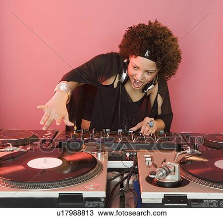 Woman working at a mixing board View Large Photo Image Stock Image - Woman working at a mixing board. Fotosearch