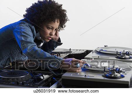 Woman working at a mixing board View Large Photo Image Stock Photo - Woman working at a mixing board. Fotosearch