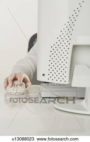 Stock Image - Woman working at computer. Fotosearch